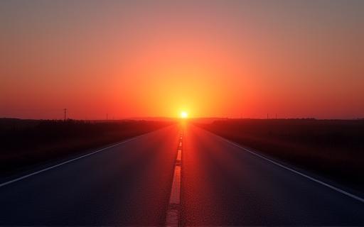 Empty open road at sunrise stretching into the distance
