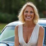 Woman next to vintage car