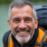 Man smiling on road trip